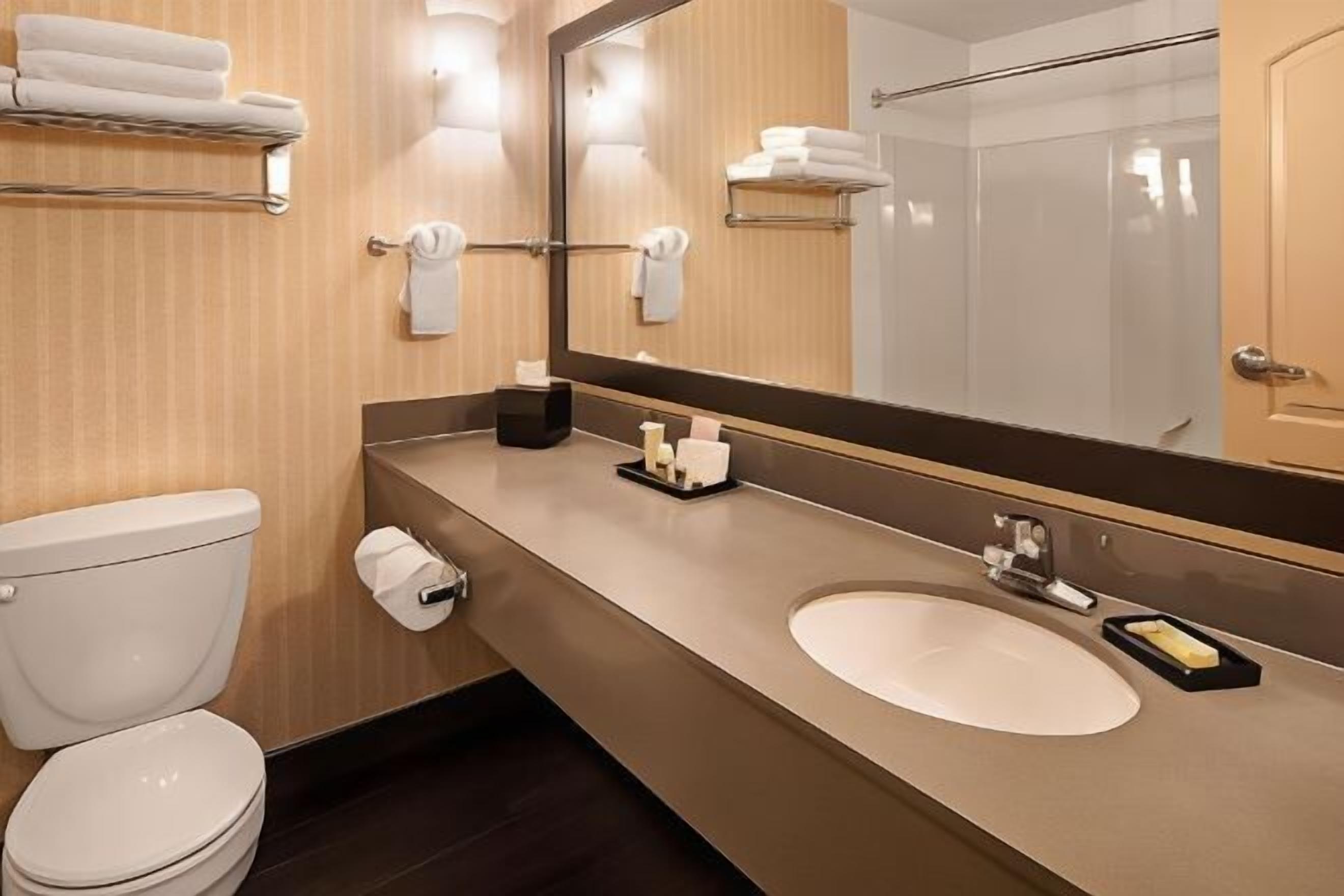 Bathroom | Designer toiletries, hair dryer, towels, soap