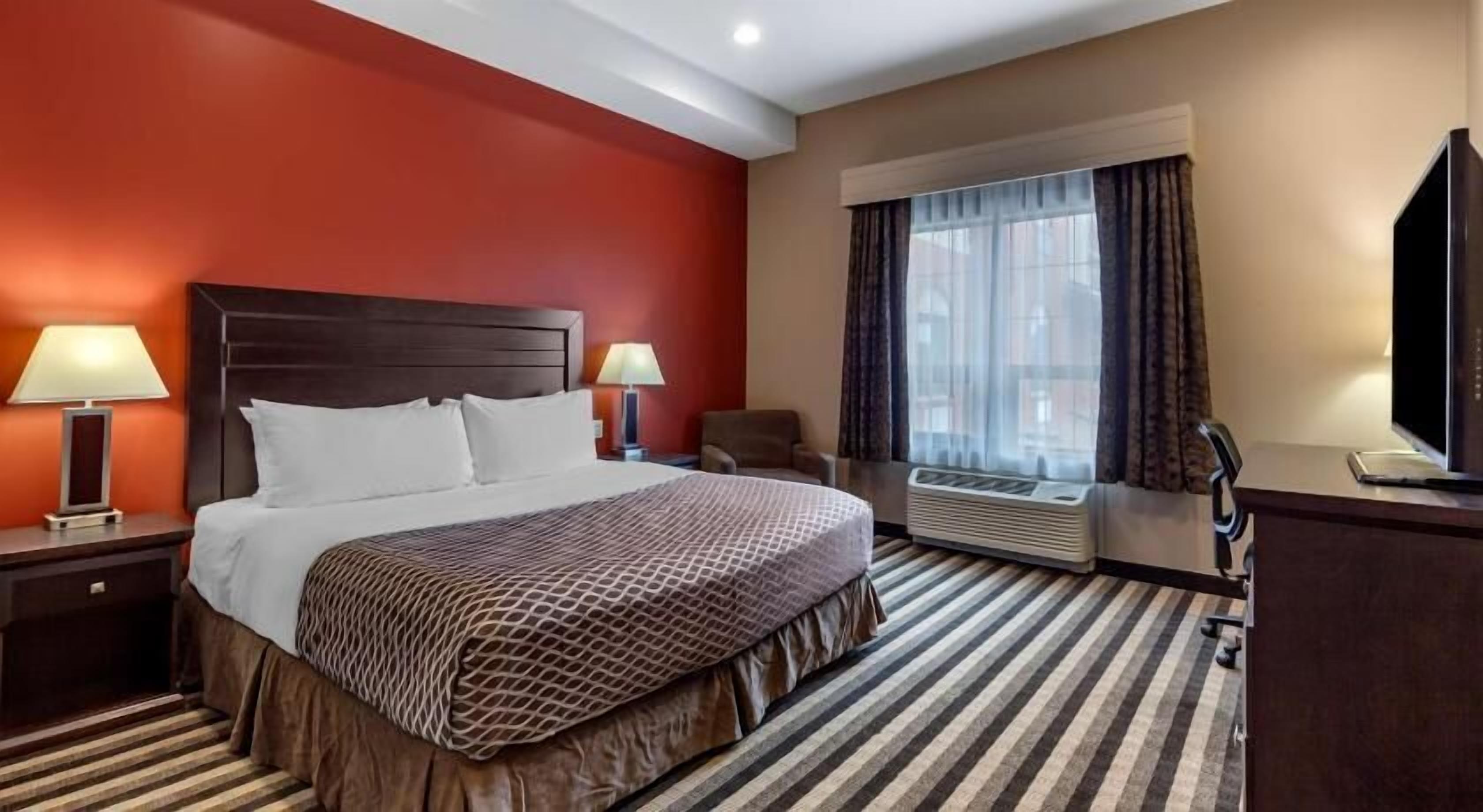 Premium bedding, pillow-top beds, desk, laptop workspace