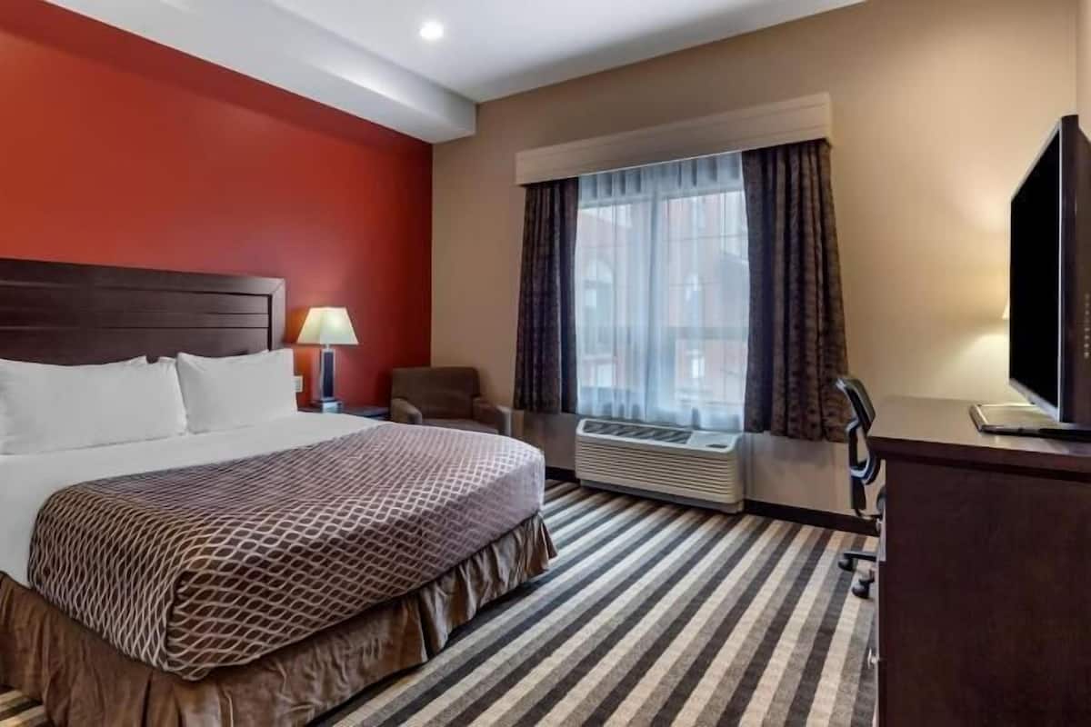 Premium bedding, pillow-top beds, desk, laptop workspace