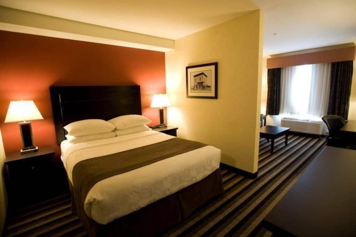 Premium bedding, pillow-top beds, desk, laptop workspace