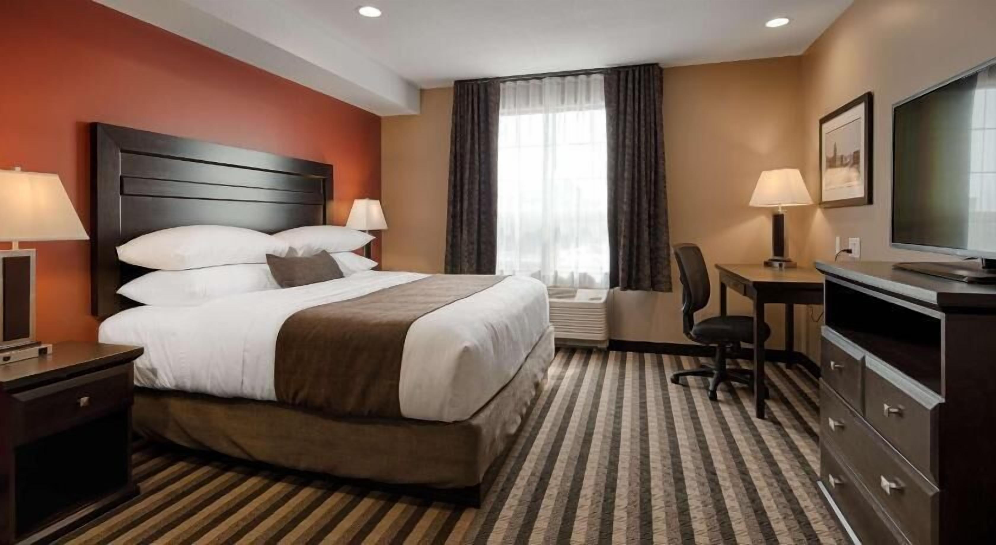 Premium bedding, pillow-top beds, desk, laptop workspace