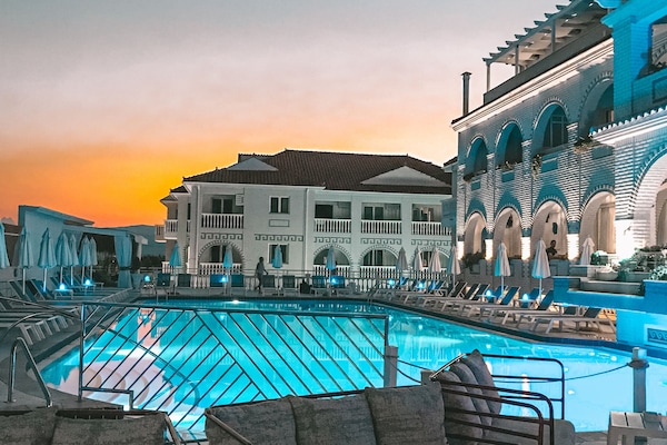 Indoor pool, seasonal outdoor pool, pool umbrellas, sun loungers