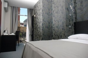 Premium bedding, down comforters, minibar, in-room safe