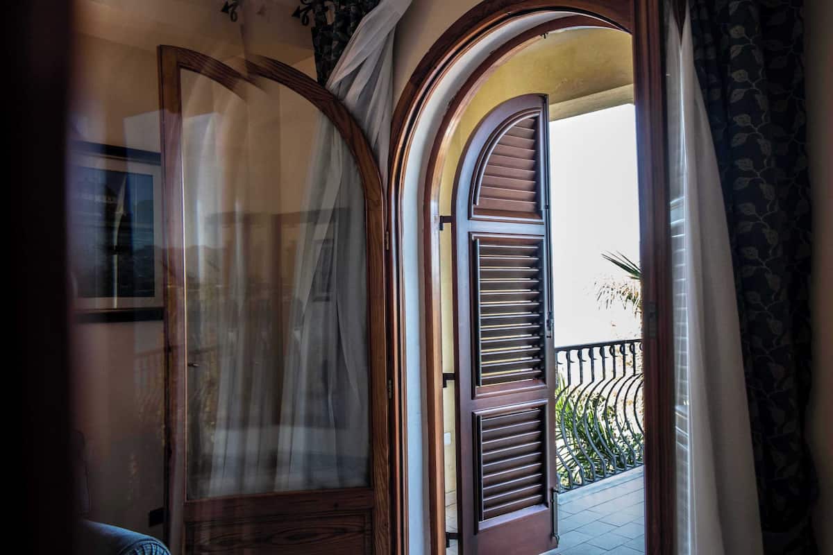 Apartment, Balcony, City View | Minibar, in-room safe, desk, laptop workspace