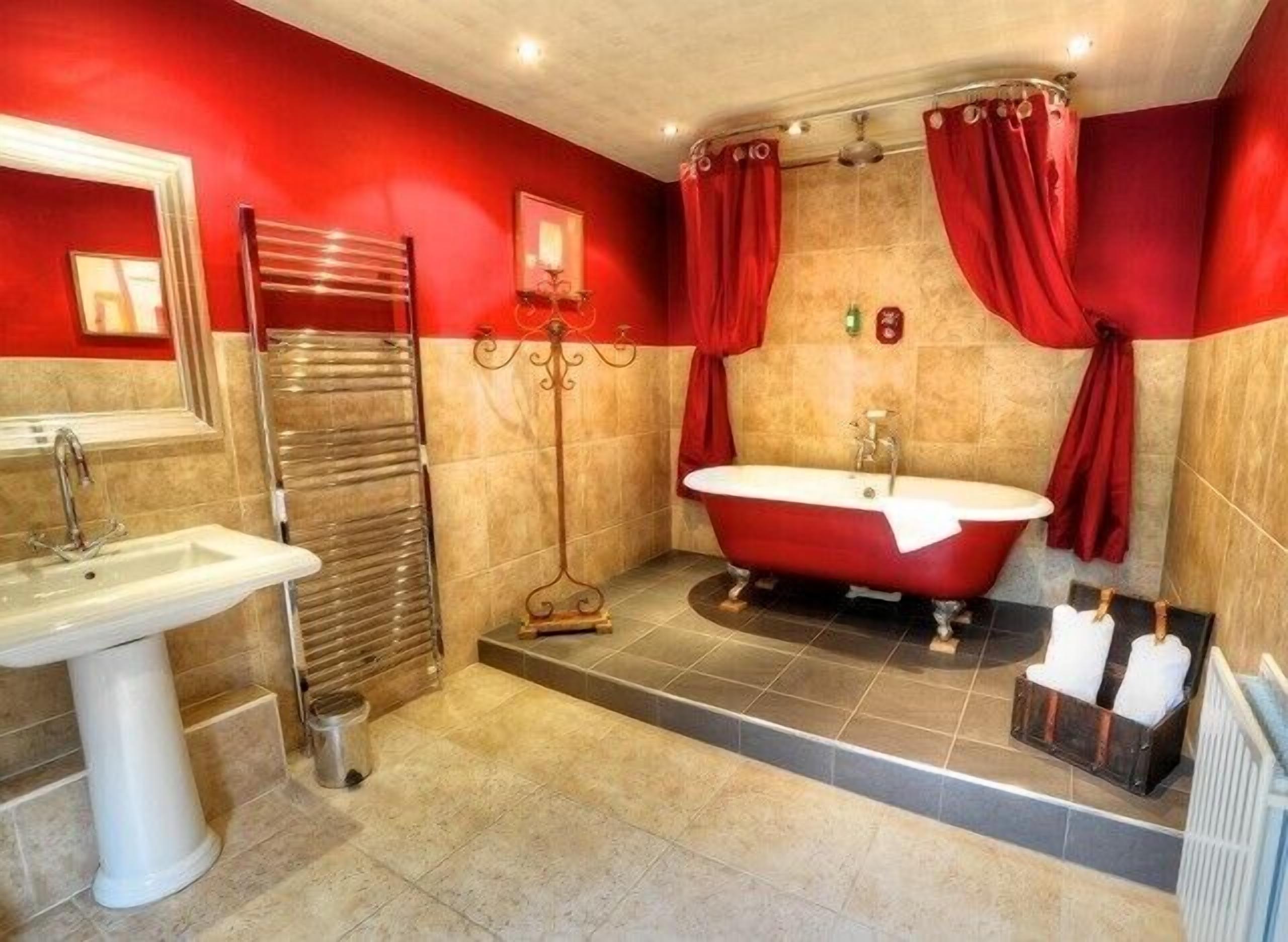 suite with four poster bed | bathroom | combined shower/bathtub, hair dryer, towels