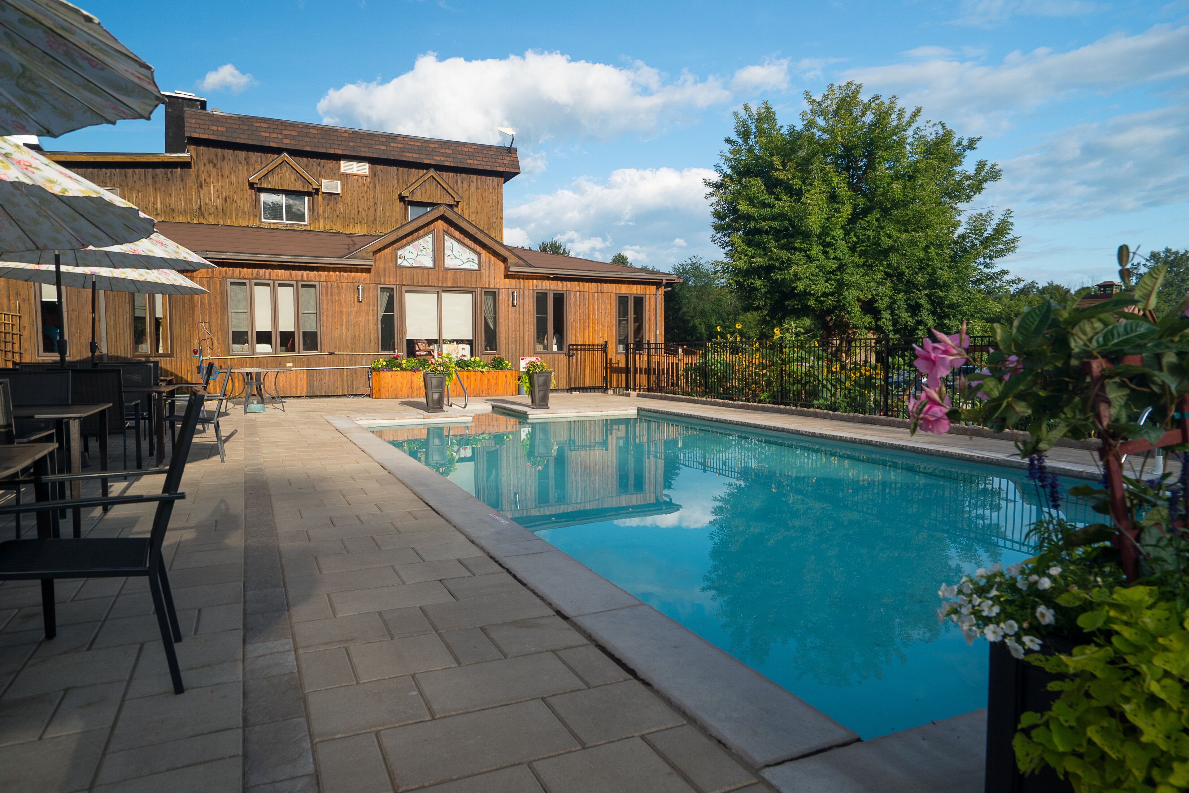 Seasonal outdoor pool, open 8:00 AM to 10:00 PM, pool umbrellas