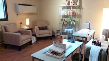 Relax in a comfortable seating area with armchairs and a sofa, perfect for unwinding or working.