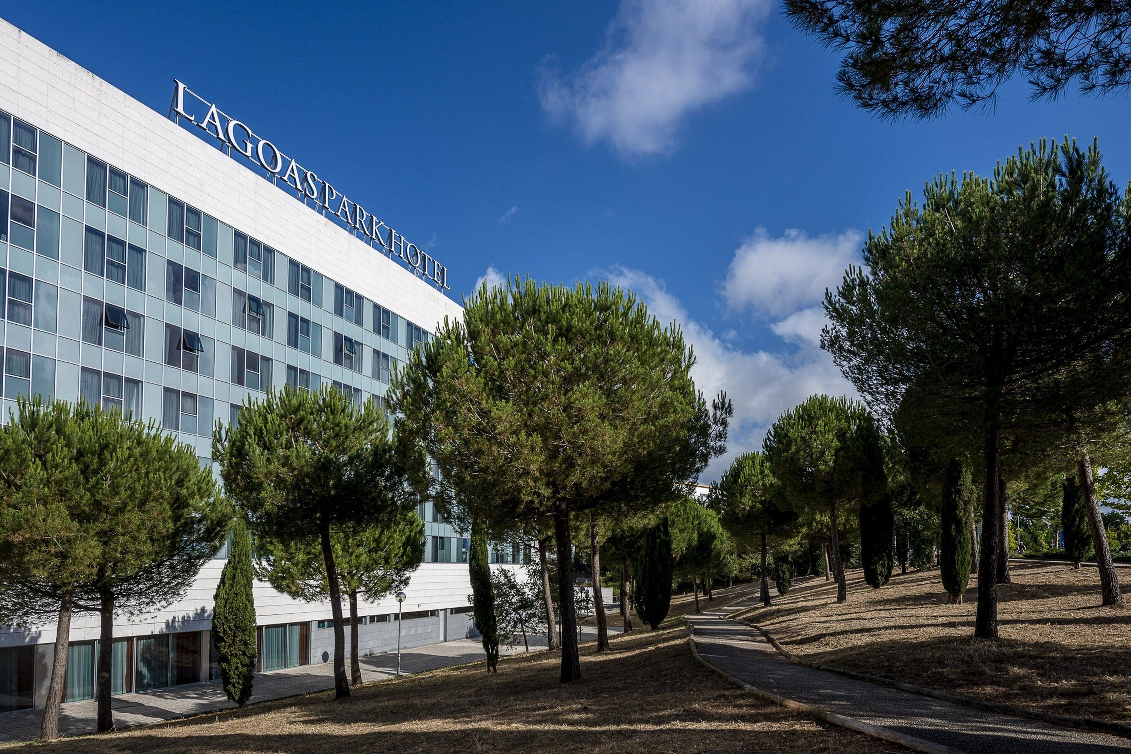 A modern building with the name "LAGOAS PARK HOTEL" on the facade.