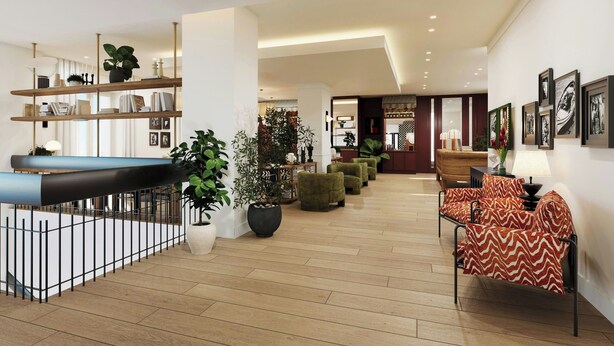 A modern interior with a pool table, seating area, and artwork on the walls.
