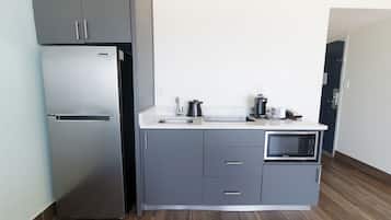 Full-size fridge, microwave, stovetop, coffee/tea maker