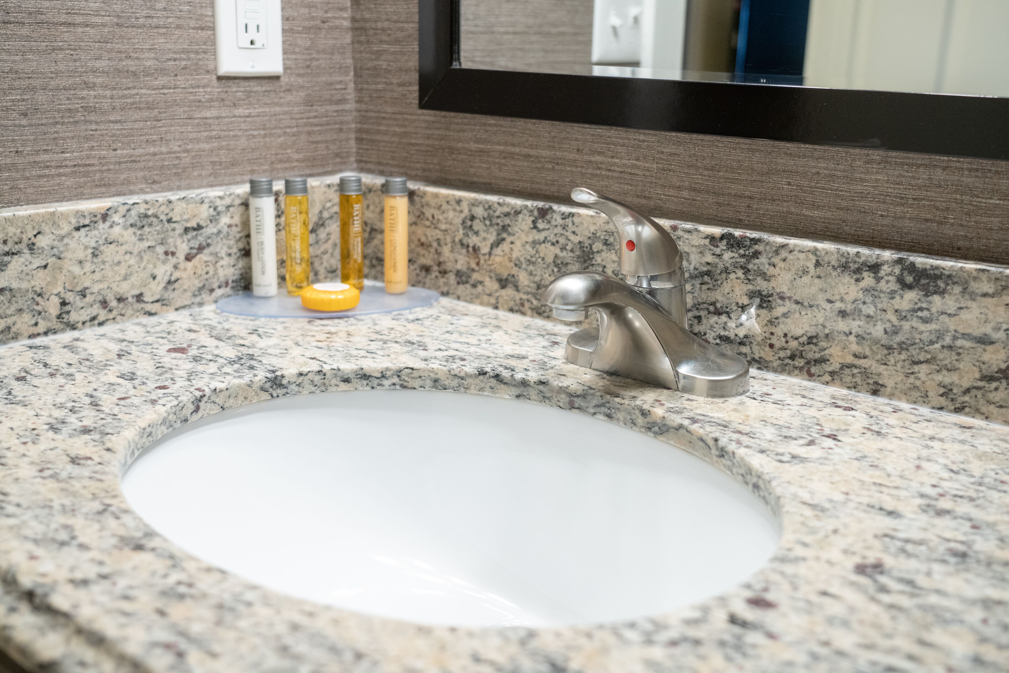 standard room, 1 king bed | bathroom | eco-friendly toiletries, hair dryer, towels