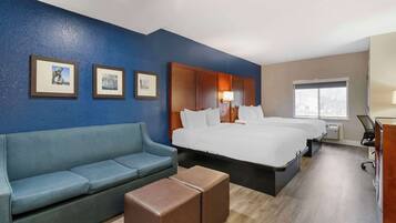 Premium bedding, desk, laptop workspace, blackout drapes