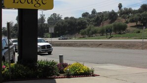 A yellow sign for the Escondido Lodge. - Escondido Lodge (Escondido)