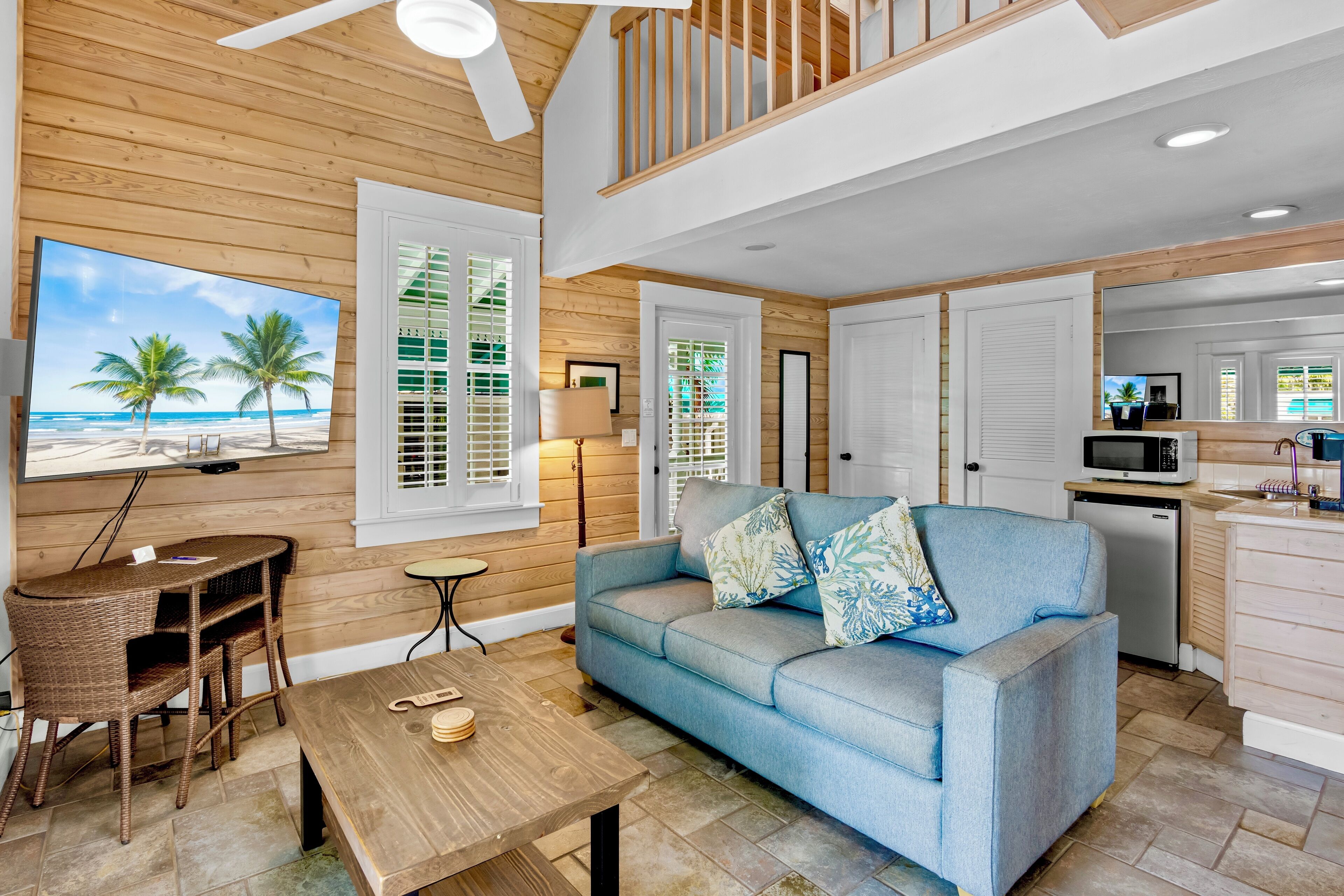 deluxe loft | living area | 32-inch smart tv with cable channels, books