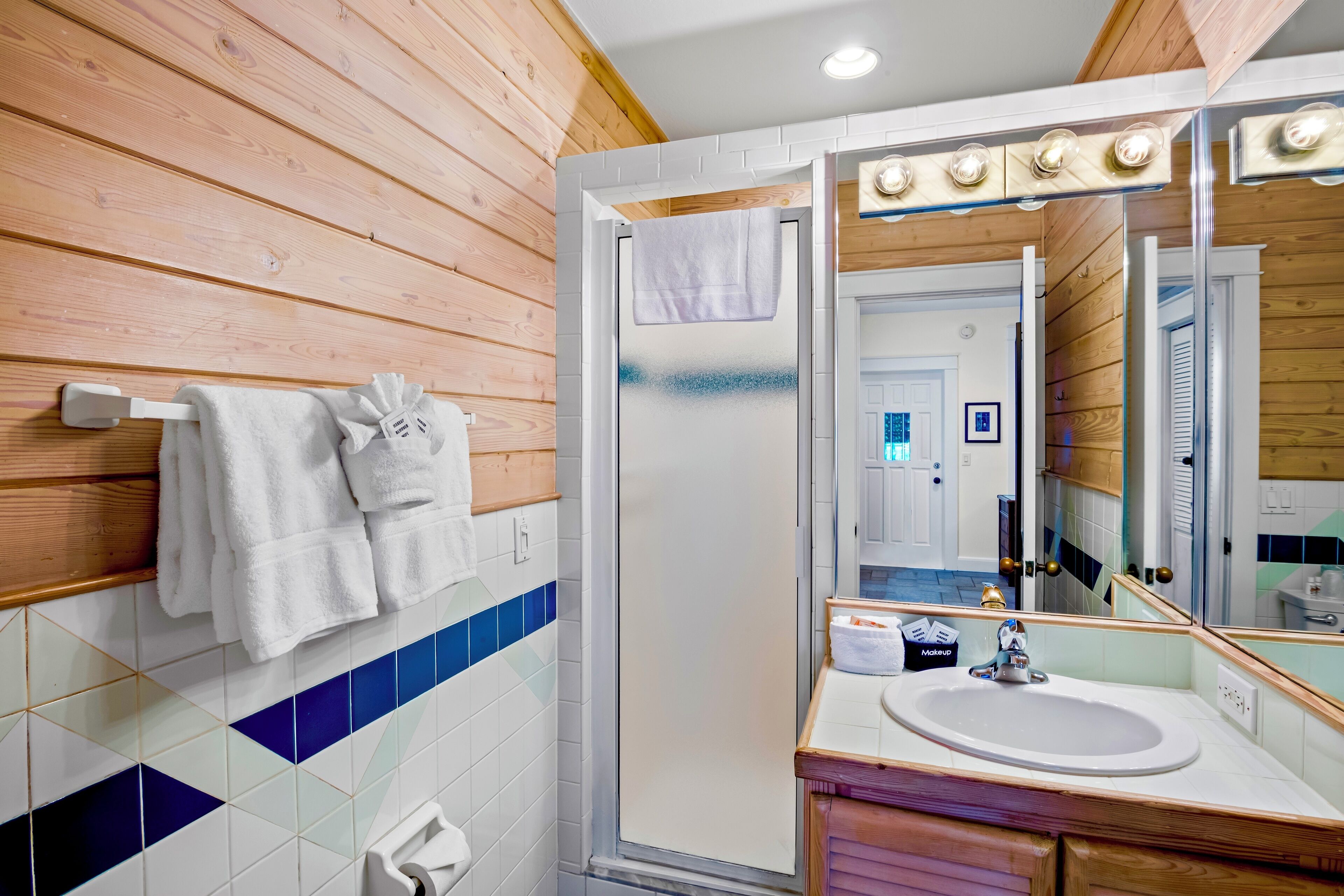 deluxe king island room | bathroom | shower, free toiletries, hair dryer, towels