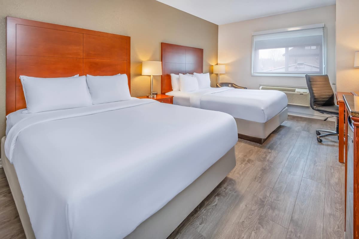 2 queen beds, sofa bed, 2 room suite | blackout curtains, iron/ironing board, free wifi, bed sheets