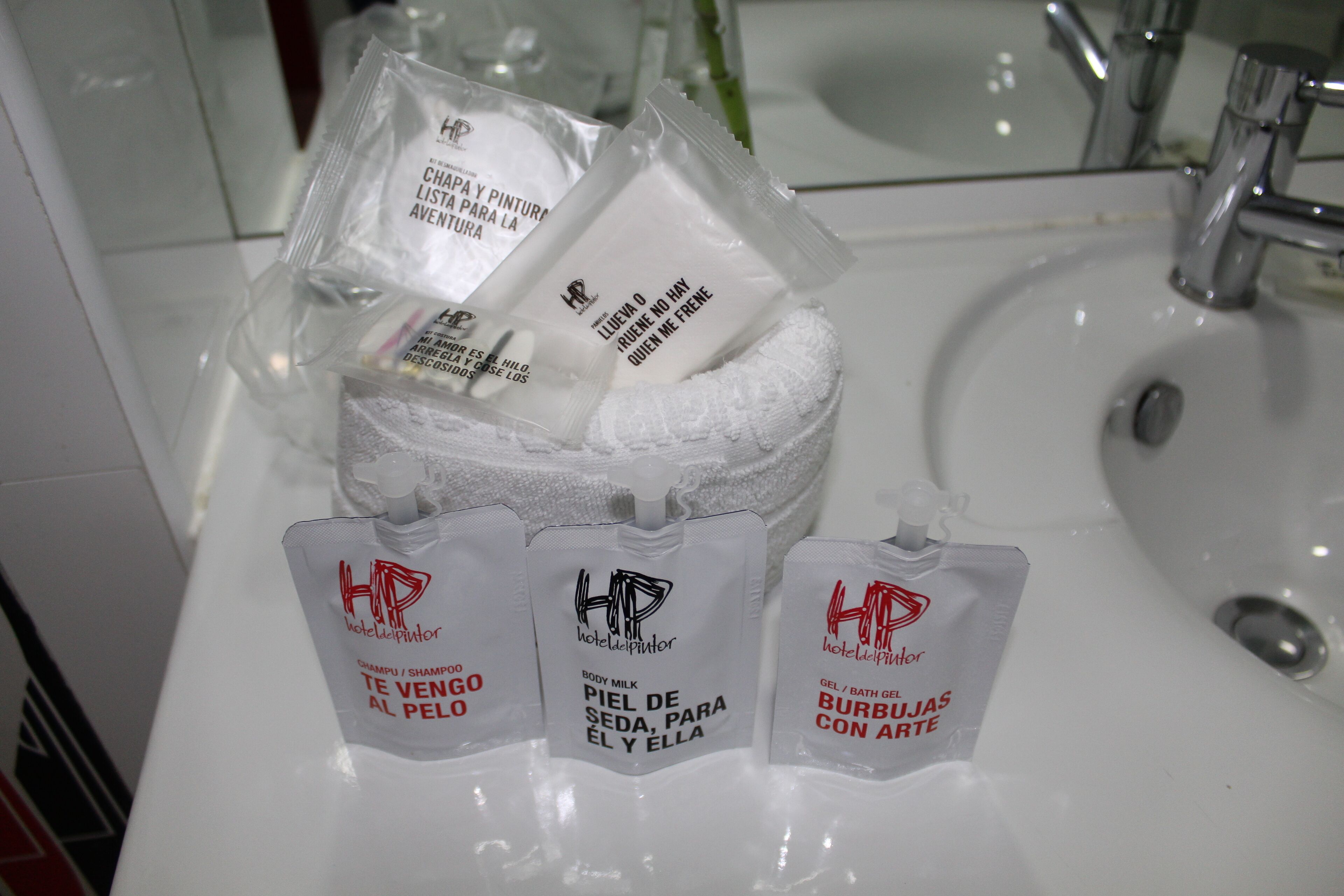 eco-friendly toiletries, hair dryer, towels