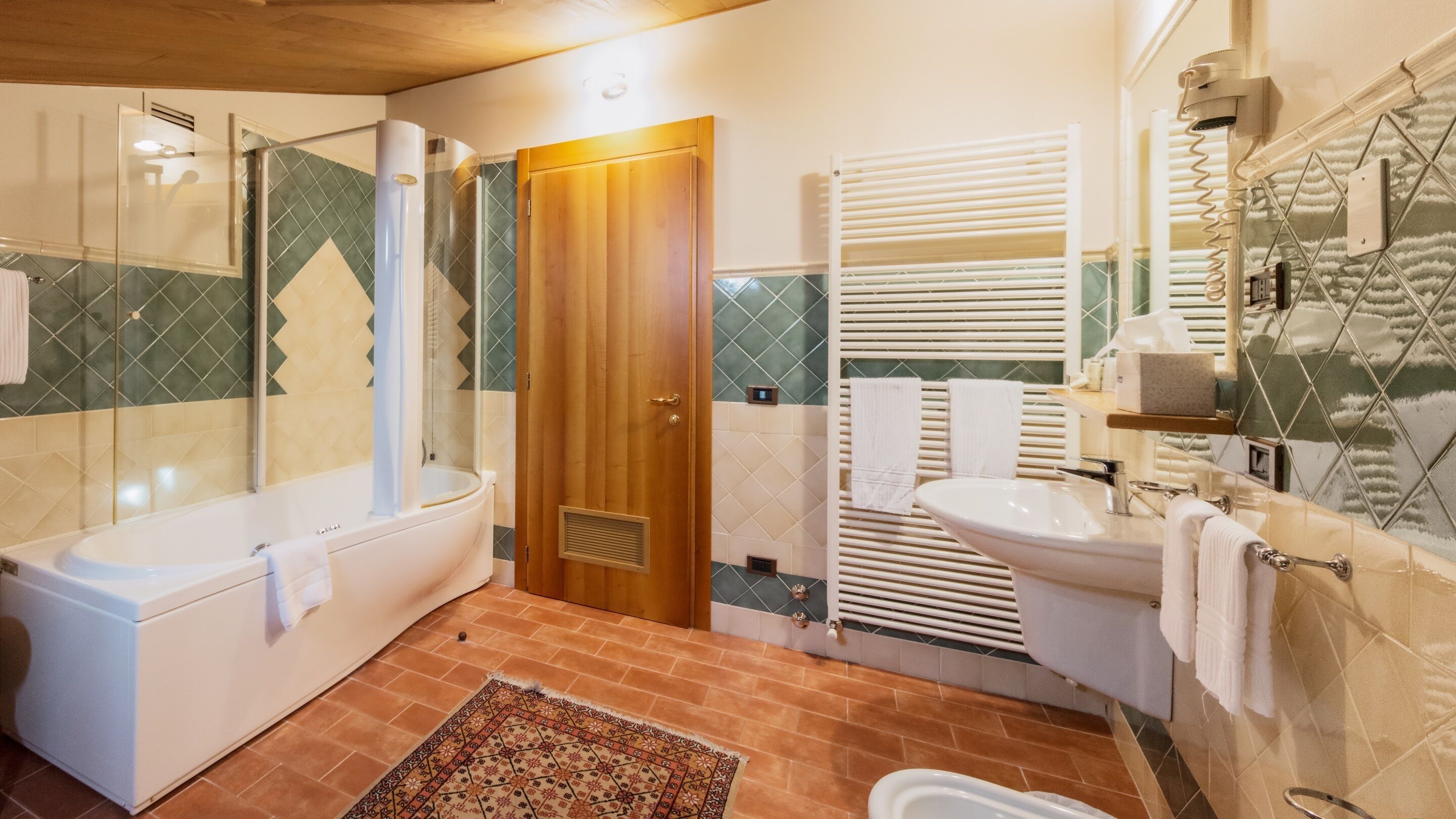 deluxe room | bathroom | separate bathtub and shower, free toiletries, hair dryer, bathrobes