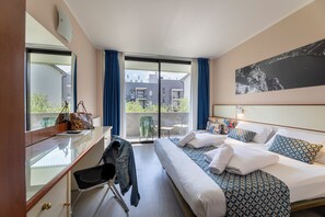 Comfort Room, Garden Area | Down comforters, in-room safe, desk, blackout drapes - Hotel Holiday Sport & Relax (Nago-Torbole)