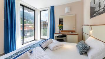 Comfort Room, Pool View, Corner | Down comforters, in-room safe, desk, blackout drapes