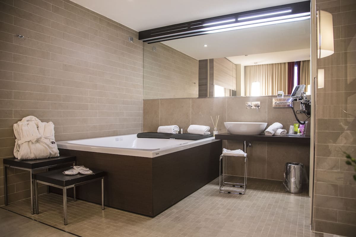 superior suite | bathroom | rainfall showerhead, free toiletries, hair dryer, bidet