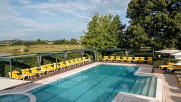 Seasonal outdoor pool, open 10 AM to 7:30 PM, pool umbrellas