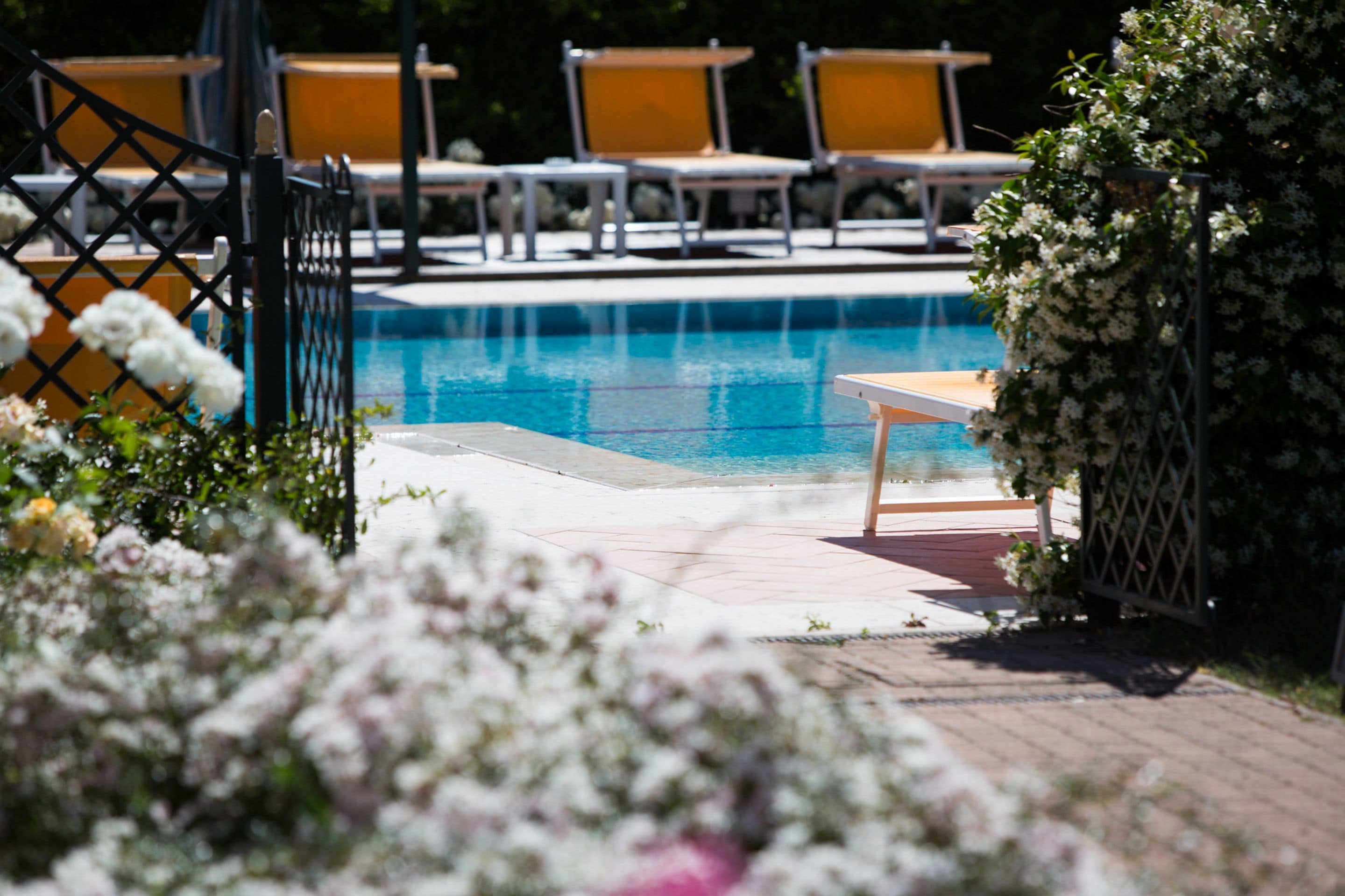 seasonal outdoor pool, open 10 am to 7:30 pm, pool umbrellas