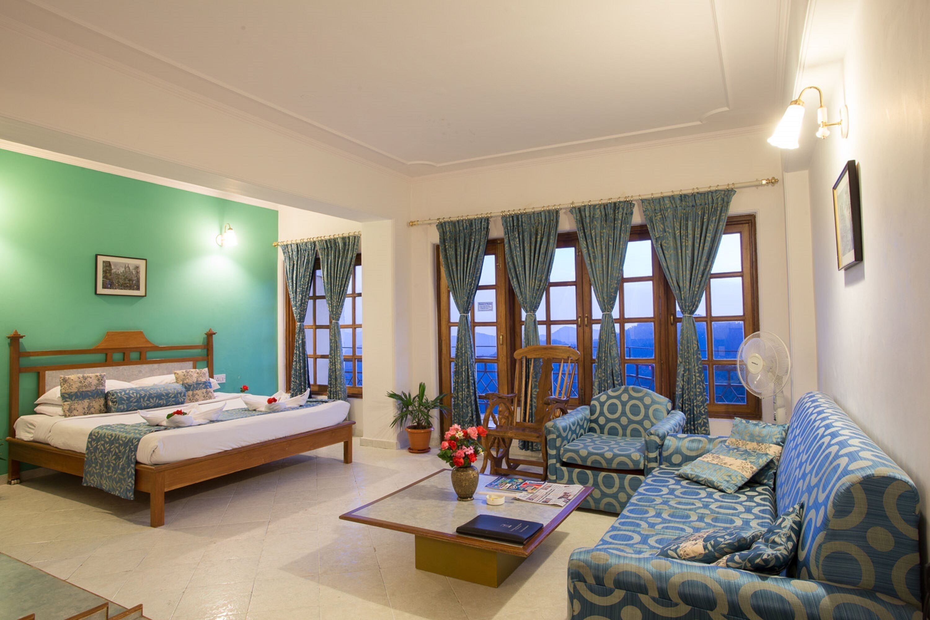 Royal Studio With Balcony and Valley View | Living area | 22-inch LCD TV with satellite channels, TV