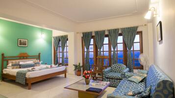 Royal Studio With Balcony and Valley View | Living area | 22-inch LCD TV with satellite channels, TV
