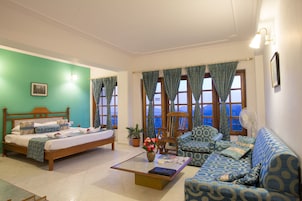 Royal Studio With Balcony and Valley View | Living area | 22-inch LCD TV with satellite channels, TV
