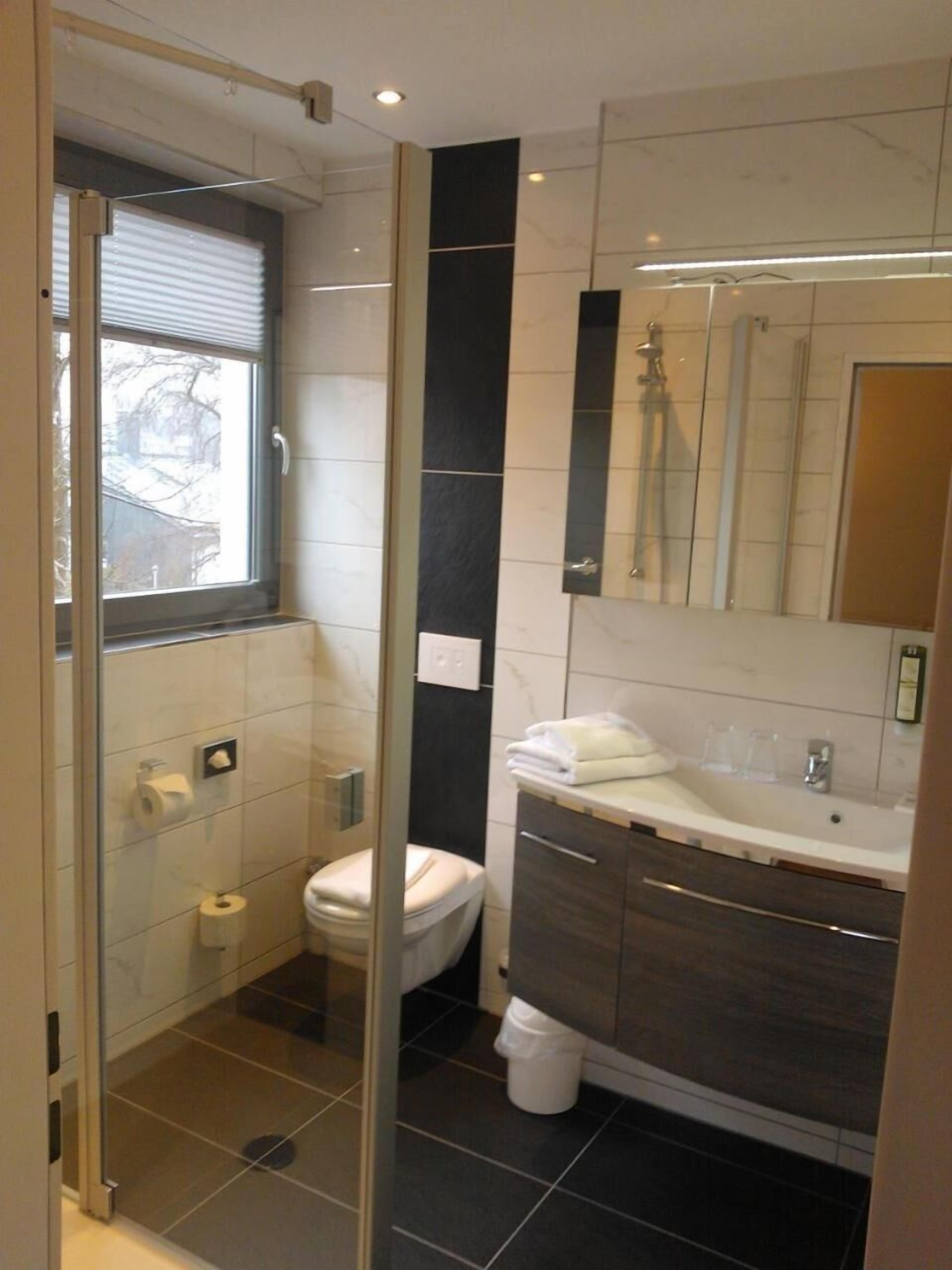 shower, hair dryer, bathrobes, towels