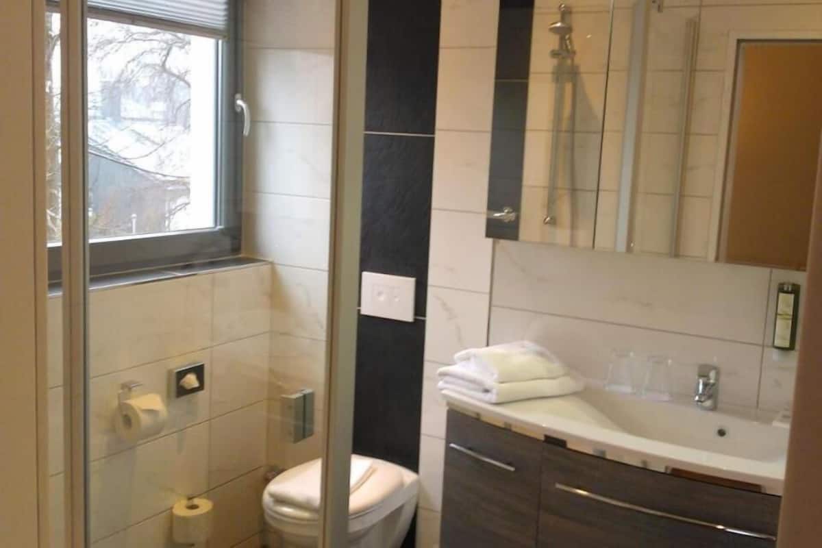 shower, hair dryer, bathrobes, towels