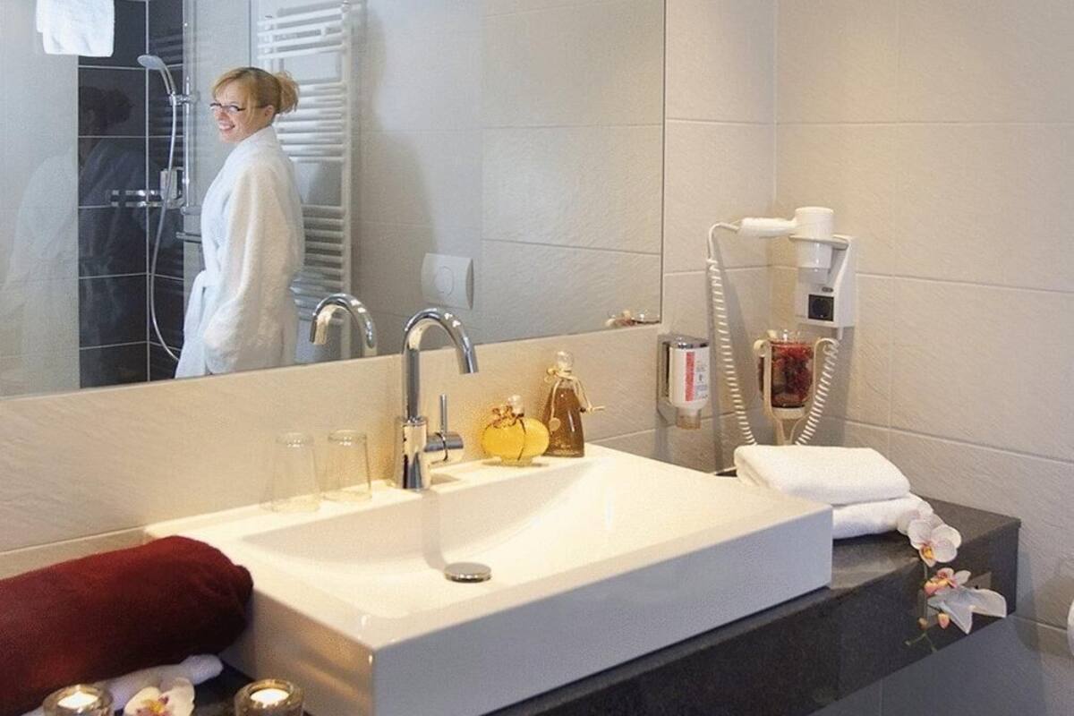 shower, hair dryer, bathrobes, towels