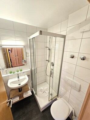 Shower, hair dryer, bathrobes, towels