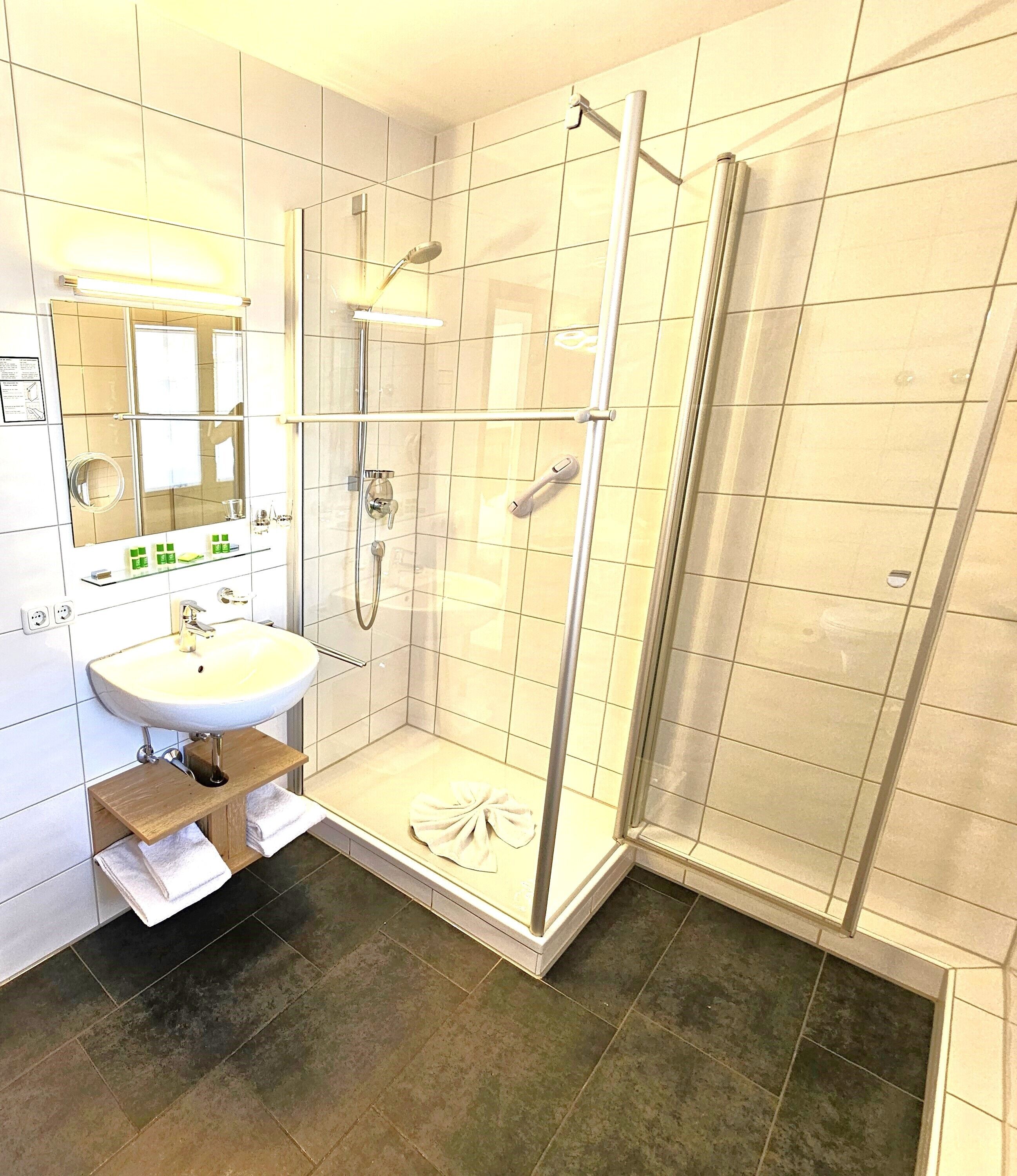 shower, hair dryer, bathrobes, towels