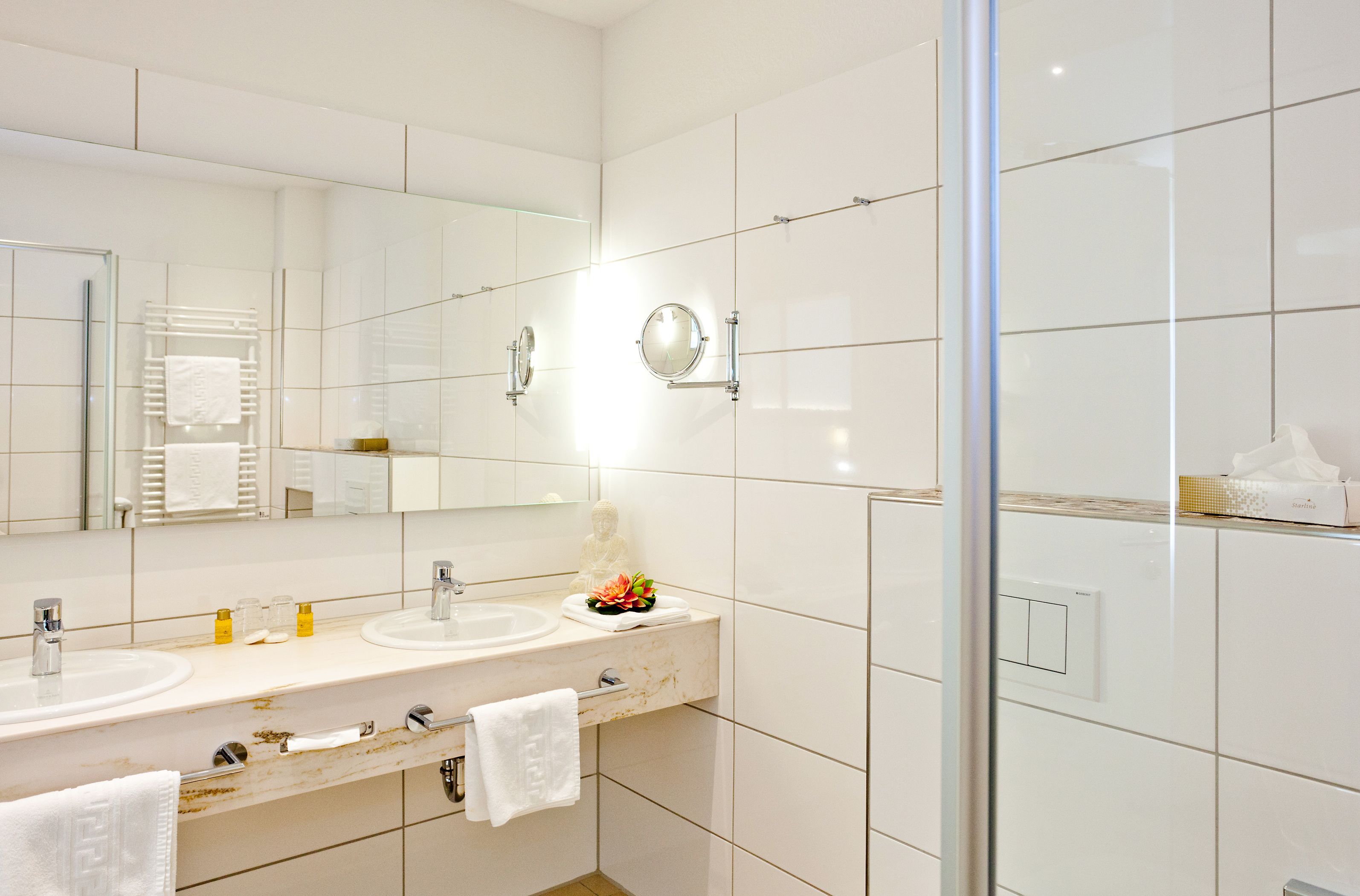 deluxe double room | bathroom | shower, hair dryer, bathrobes, towels