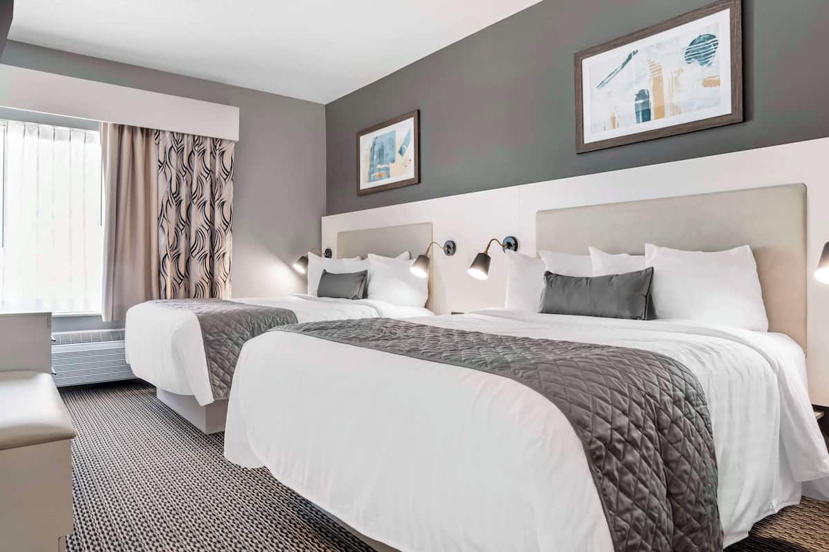 Suite, 2 Queen Beds, Non Smoking, Kitchenette | Desk, laptop workspace, iron/ironing board, WiFi
