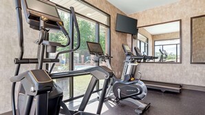 A gym with treadmills, elliptical machines, and a stationary bike. - Best Western Plus Two Rivers Hotel & Suites (Demopolis)