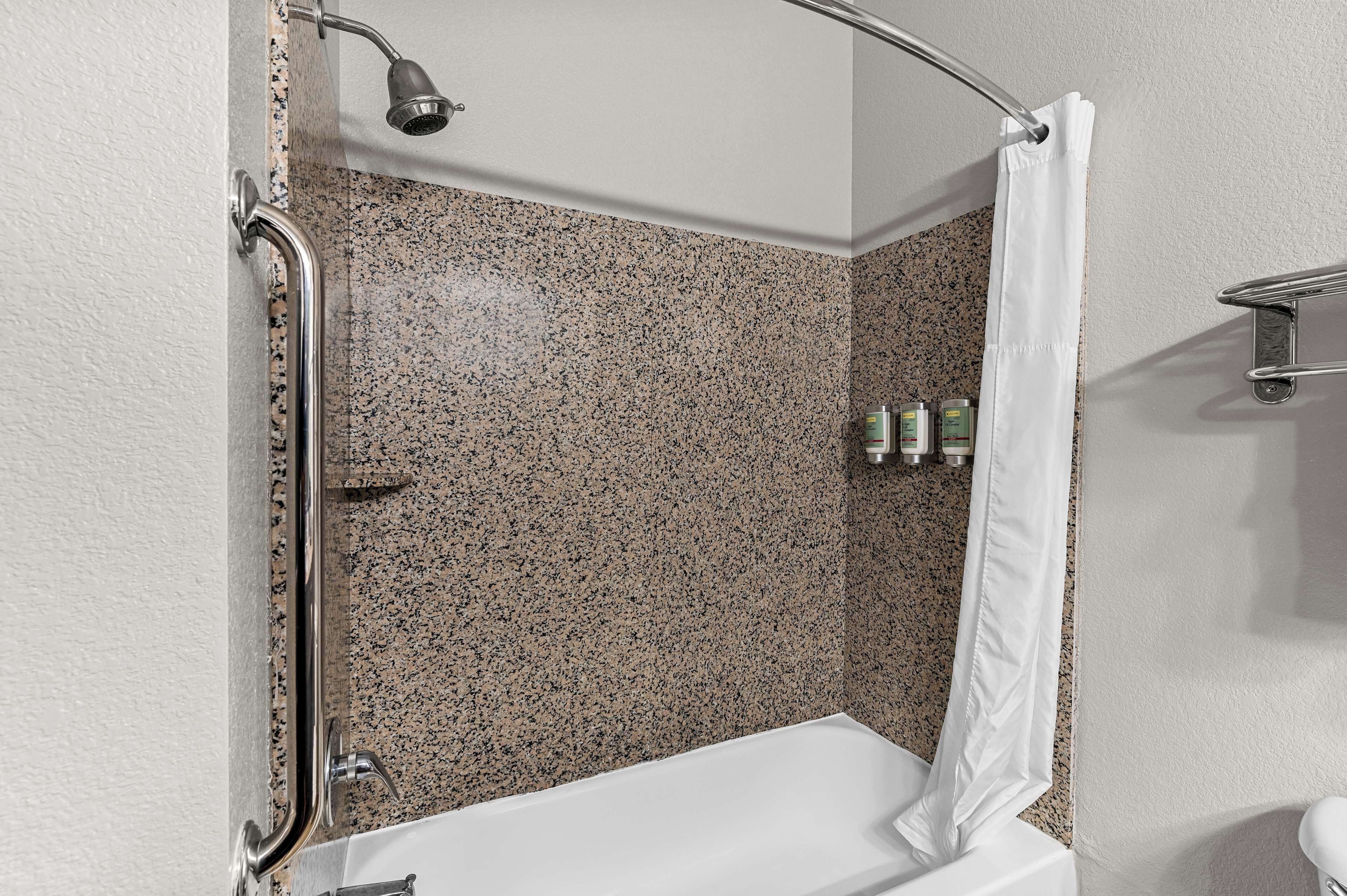 standard room, 1 king bed, non smoking, refrigerator & microwave | bathroom | combined shower/bathtub, free toiletries, hair dryer, towels