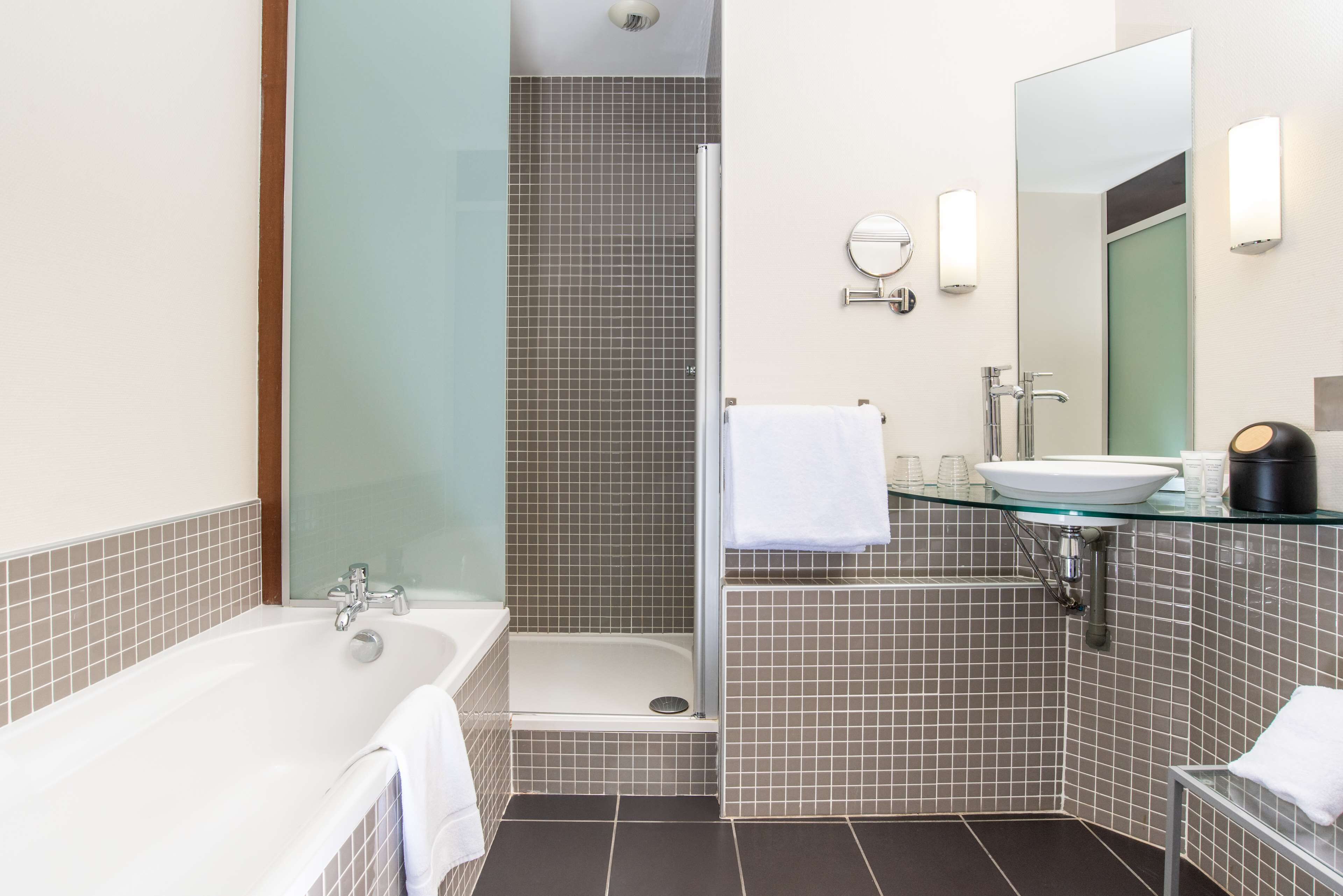 bathtub, free toiletries, hair dryer, towels