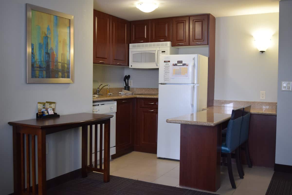 full-sized fridge, microwave, stovetop, dishwasher