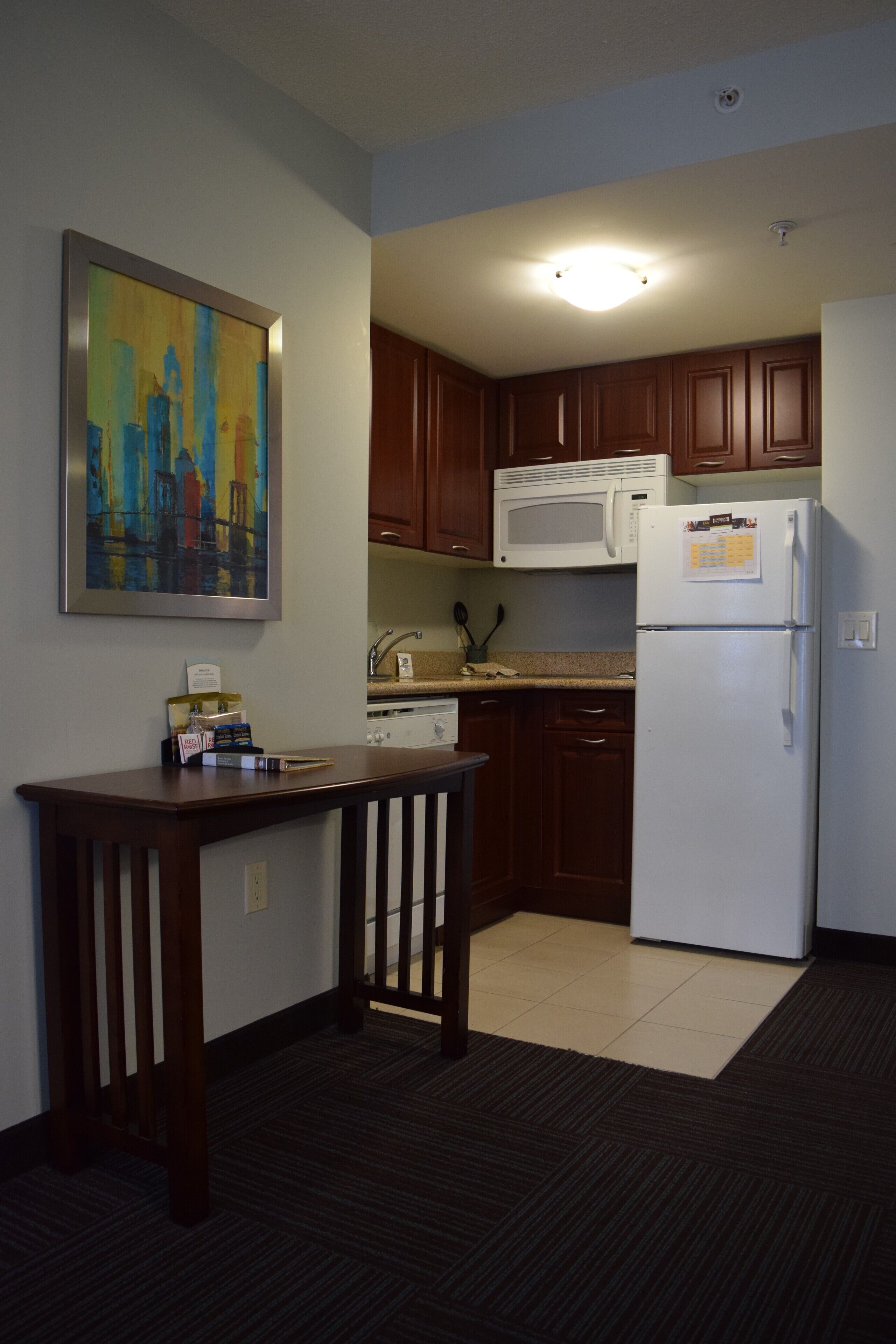 full-sized fridge, microwave, stovetop, dishwasher