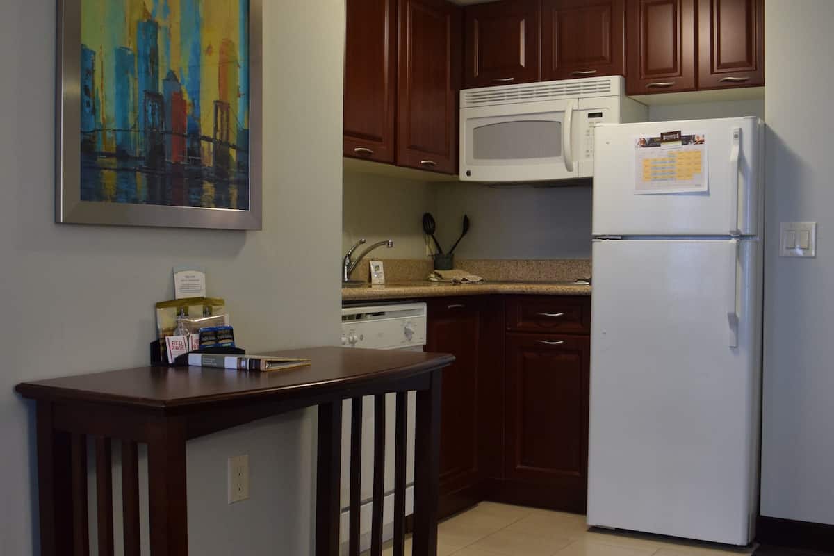 full-sized fridge, microwave, stovetop, dishwasher