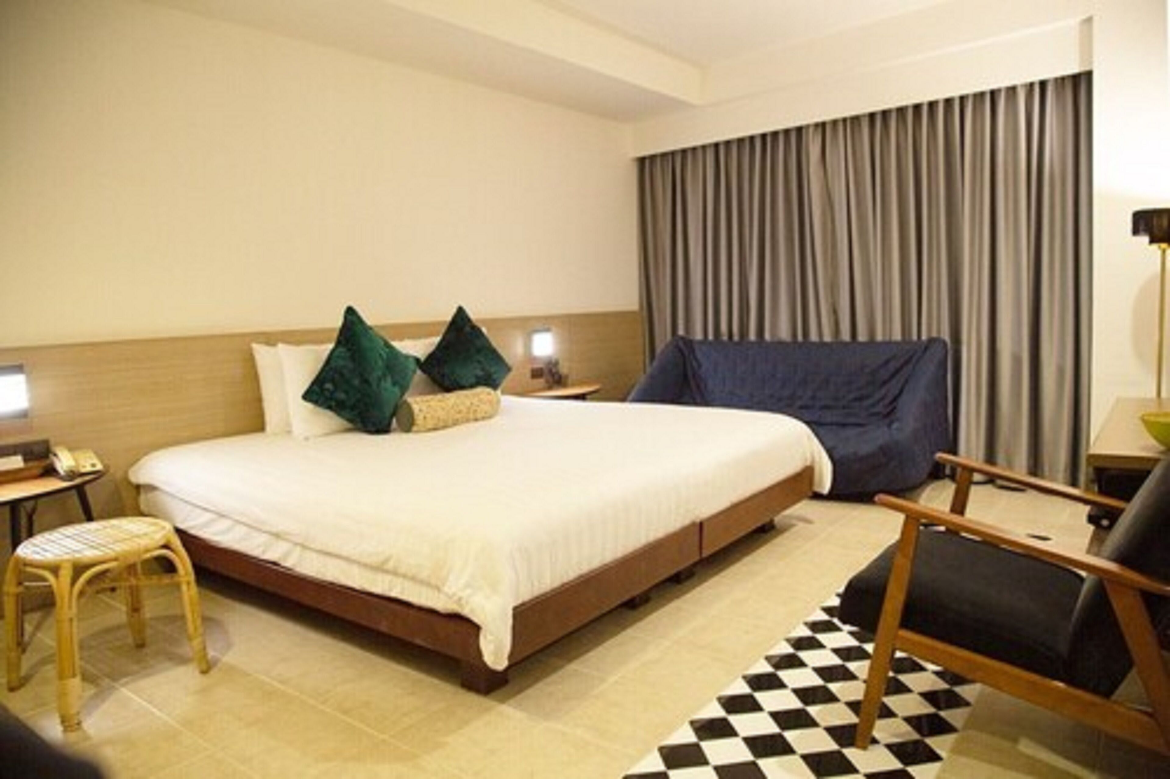 economy room | minibar, in-room safe, desk, blackout curtains