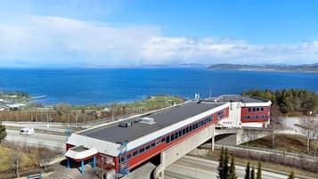 Situated near the ocean, this commercial property offers stunning views of the coastline and surrounding landforms.