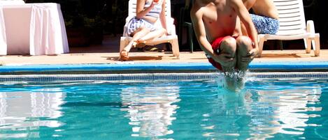 Outdoor pool, open 8:00 AM to 8:00 PM, sun loungers