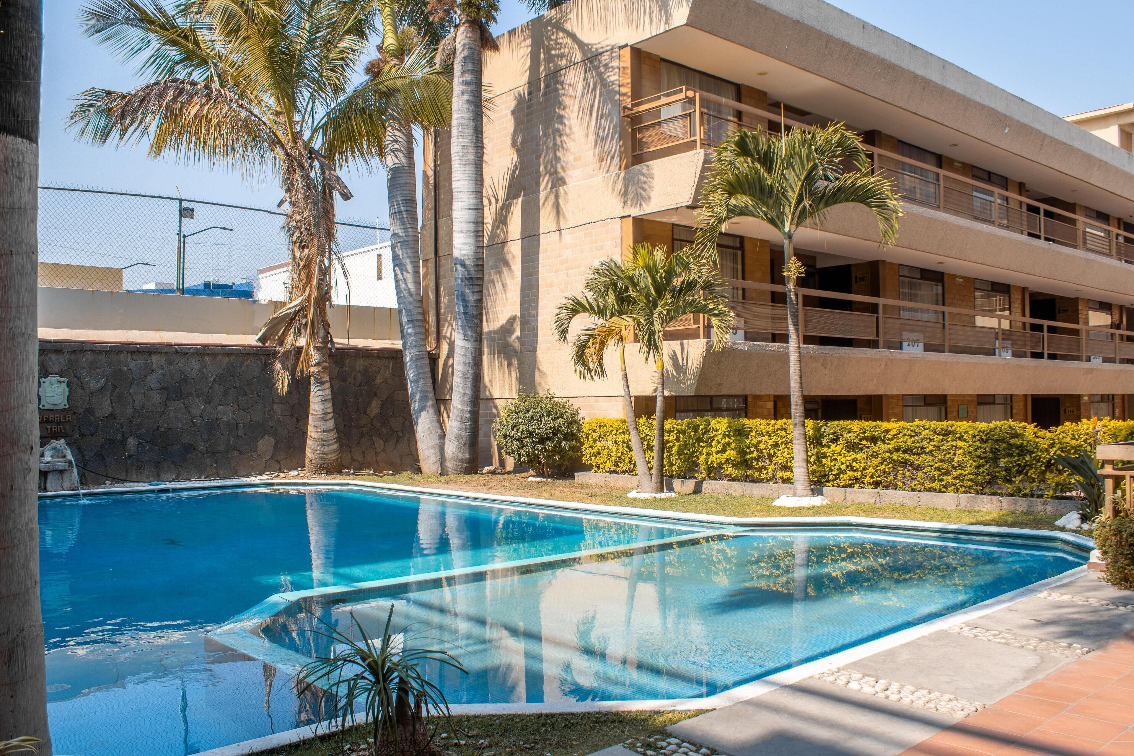 Outdoor pool, open 8:00 AM to 8:00 PM, sun loungers