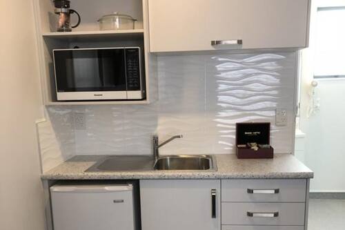 Mini-fridge, microwave, stovetop, electric kettle