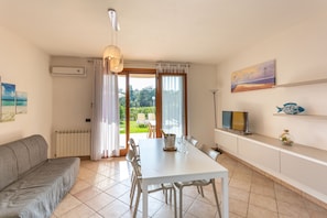 Apartment, 2 Bedrooms | Living area | TV, fireplace, table tennis