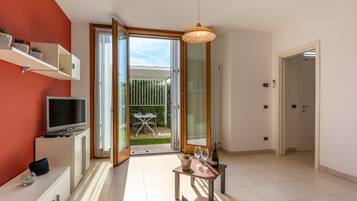 Apartment (2 levels- 6 pax) | Living area | TV, fireplace, ping pong